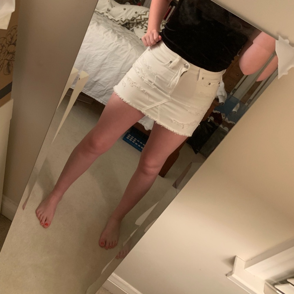 Distressed white denim skirt